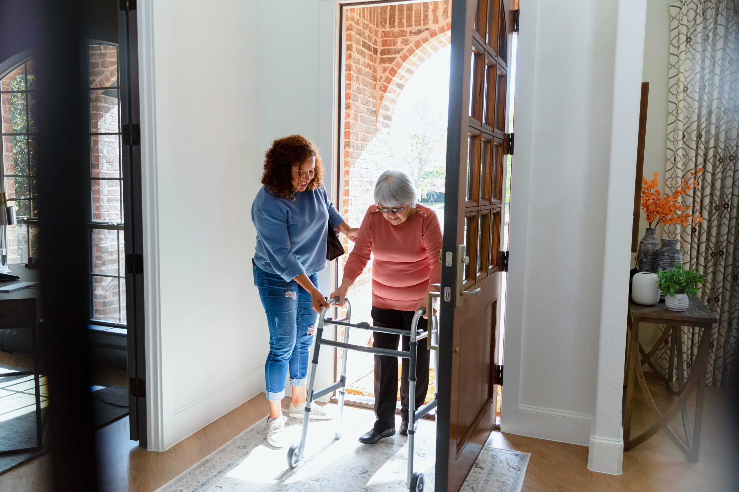 Mid Adult Woman Helps Her Senior Adult Friend